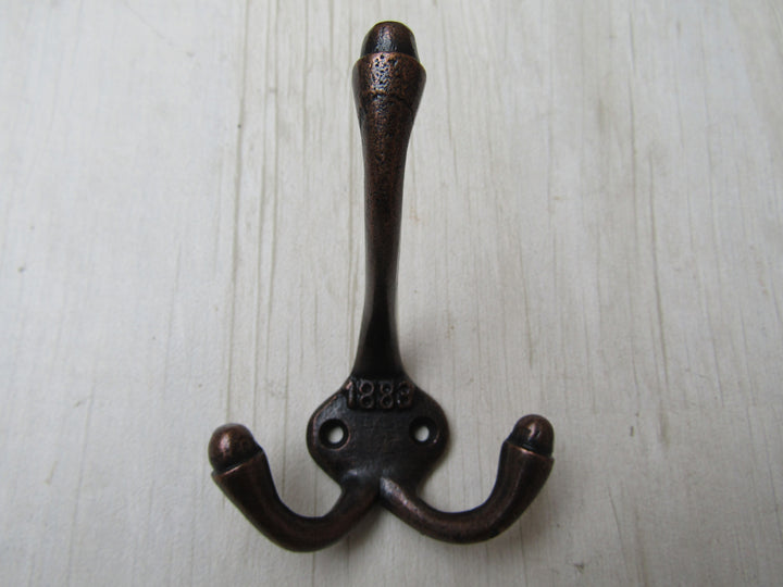 Small 1883 Embossed Coat Hook Antique Copper.