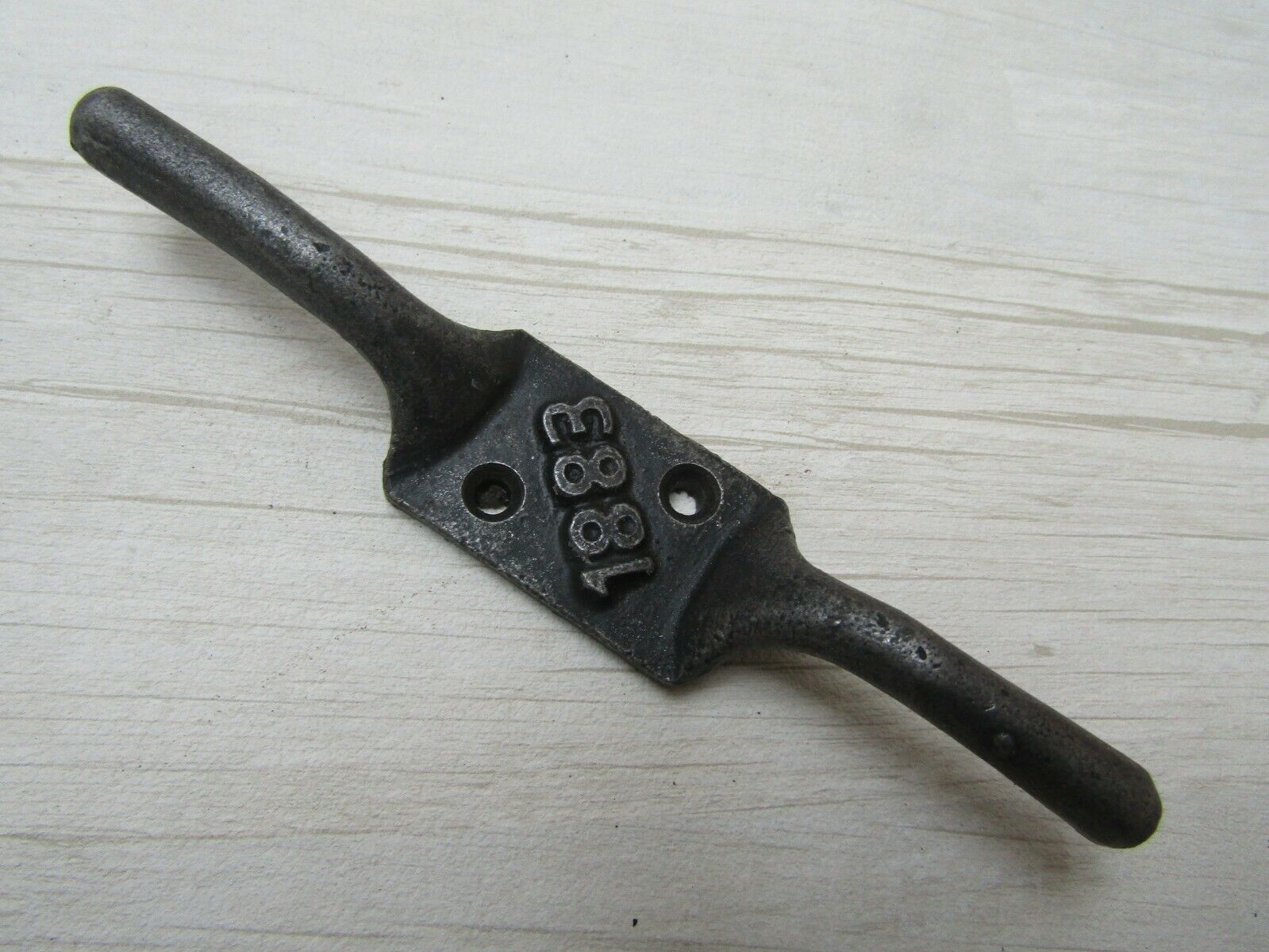 1883 Embossed Cleat Hook.