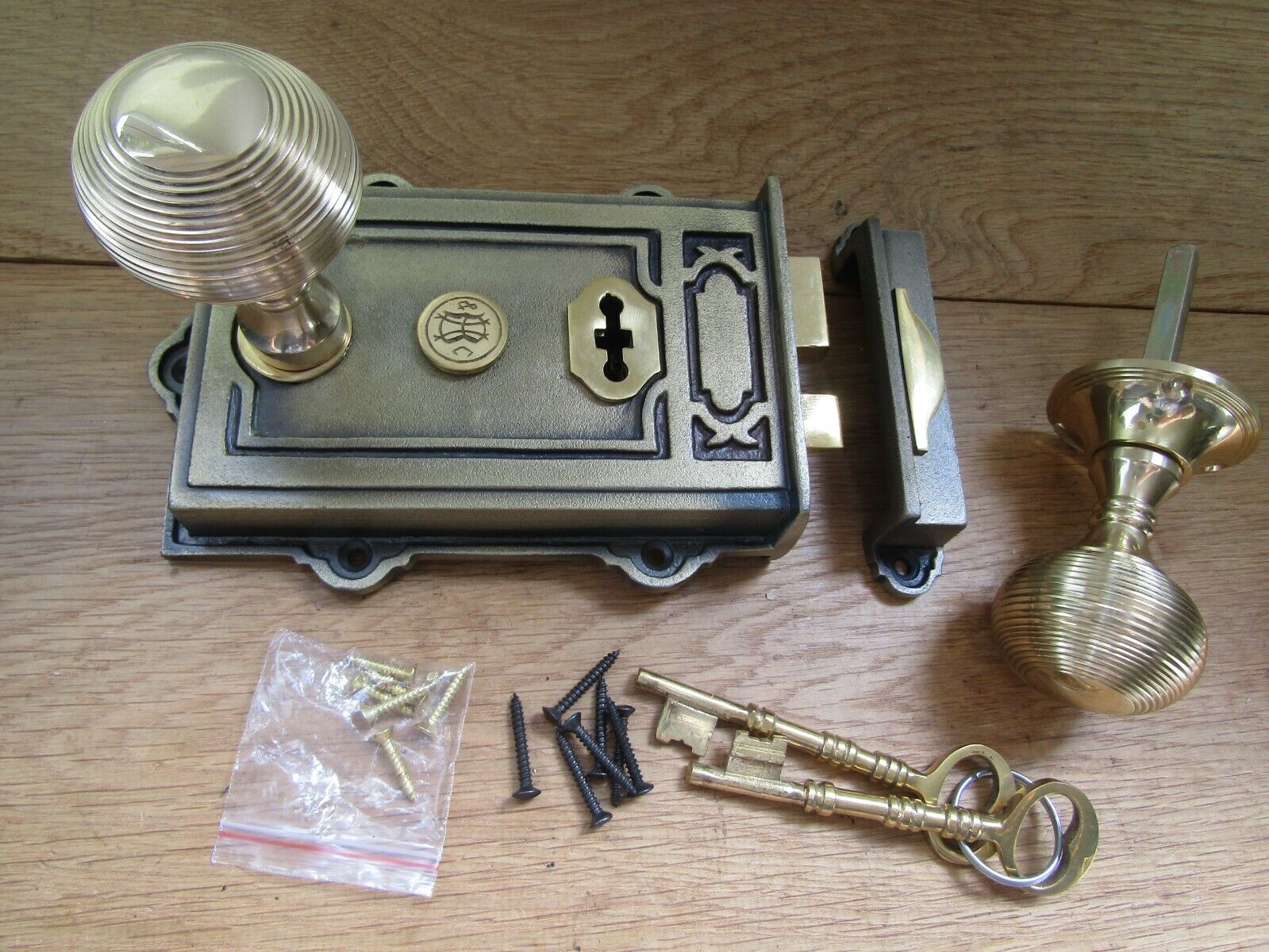 Cast Iron Davenport Rim Lock Antique Brass & Beehive Reeded Knob Polished Brass.