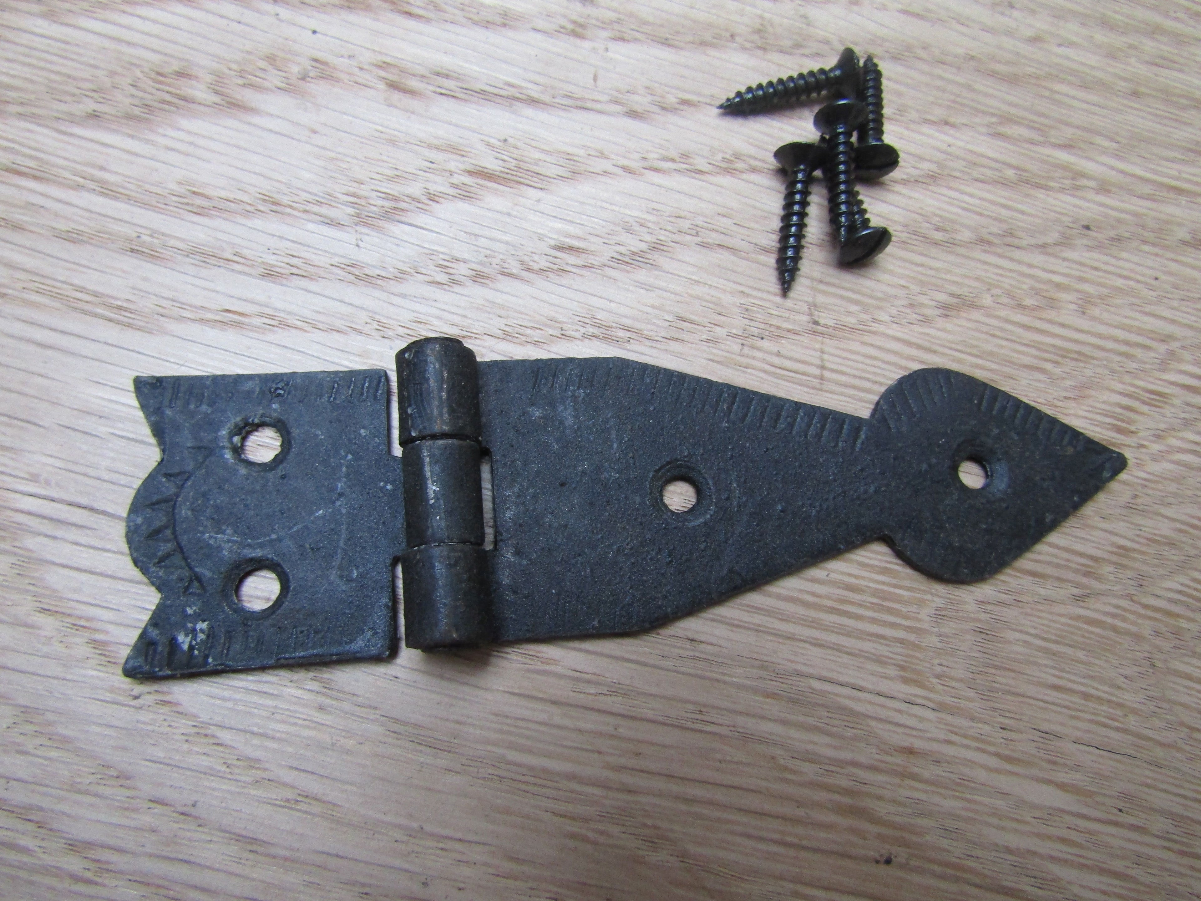 Pair Of Arrow Head Cabinet Hinges Black Wax.