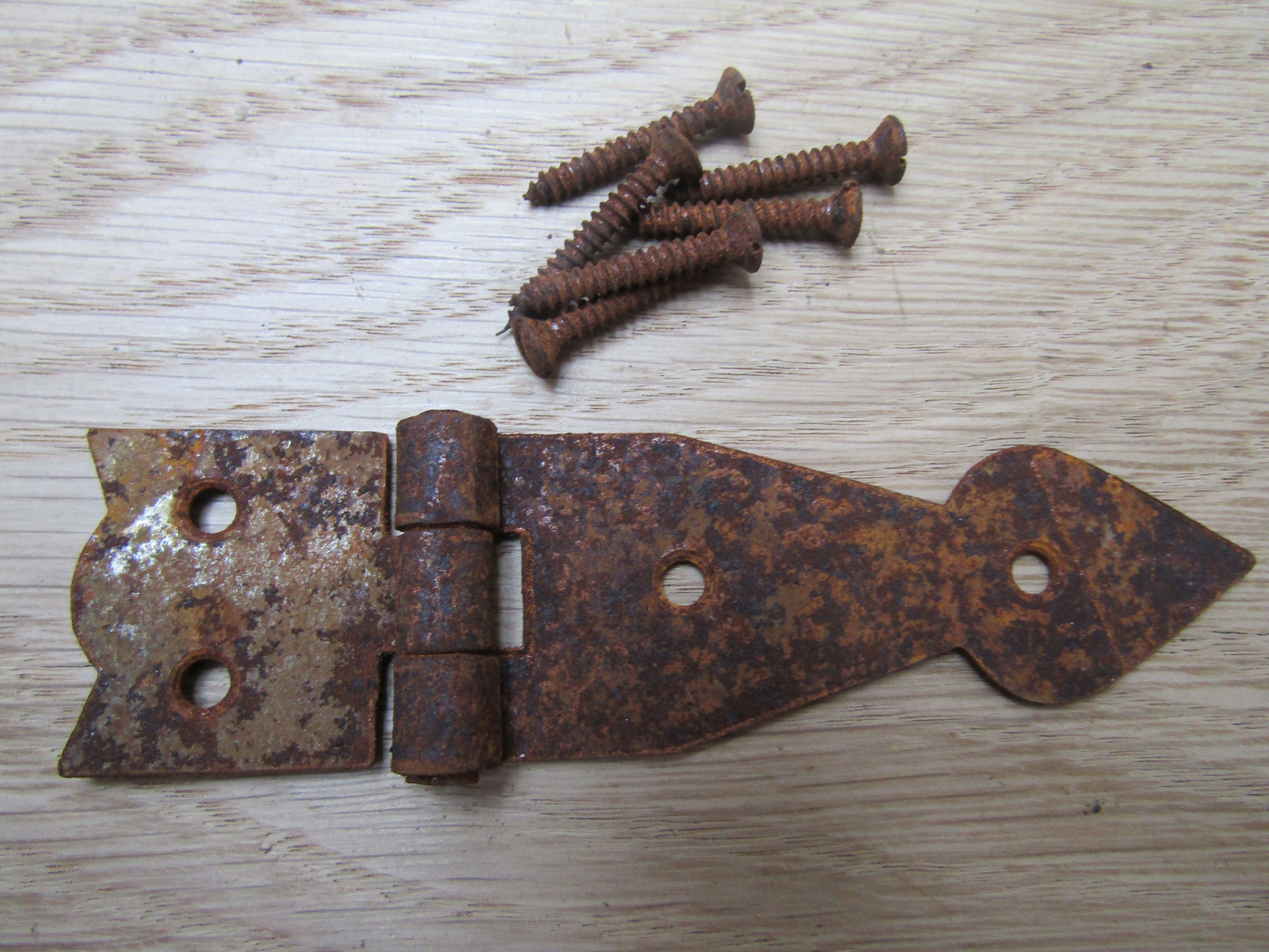 Pair Of Arrow Head Cabinet Hinges Rust.