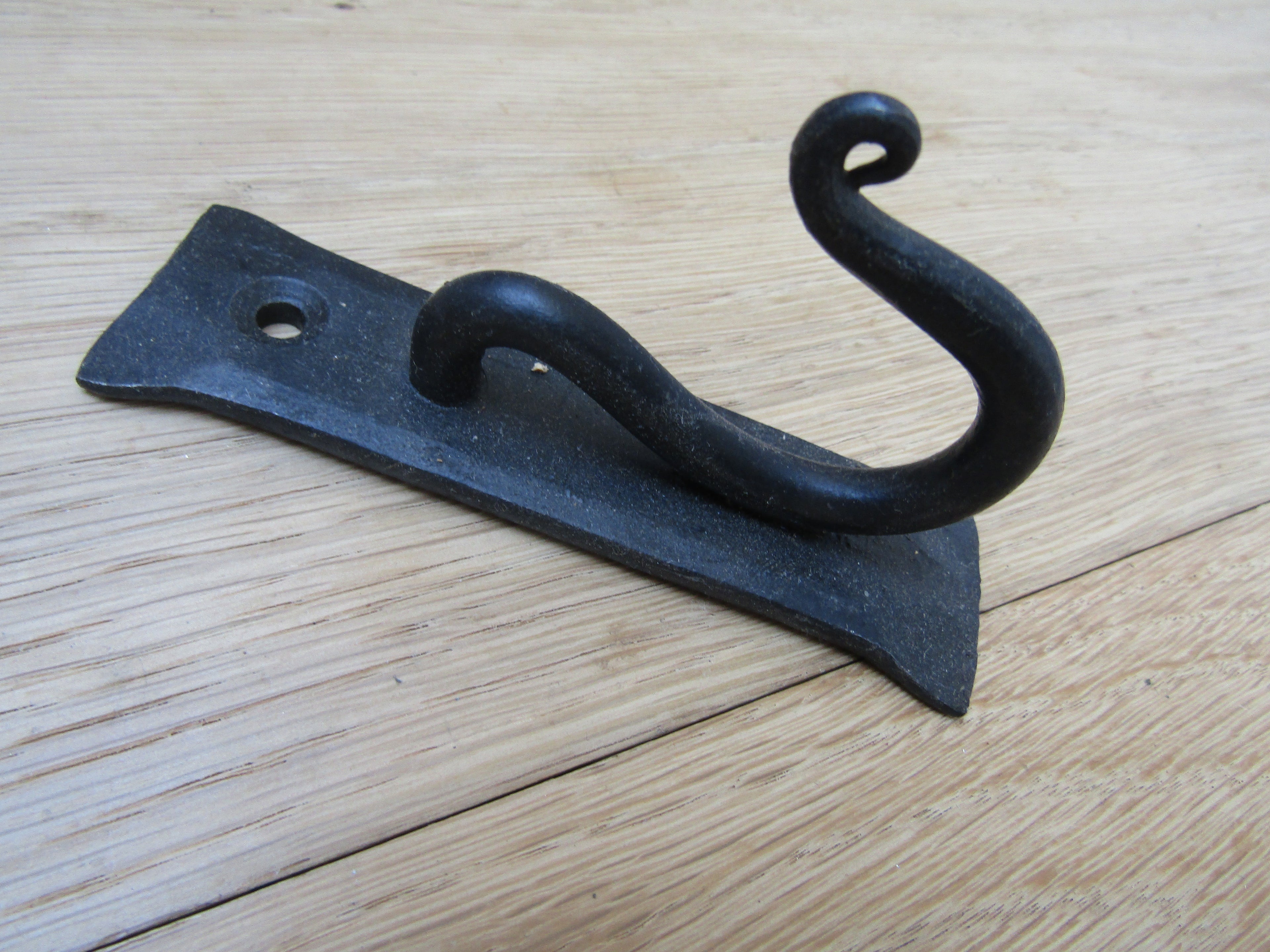 Curly Hook on Backplate black wax.