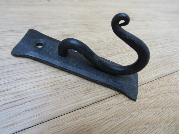 Curly Hook on Backplate black wax.
