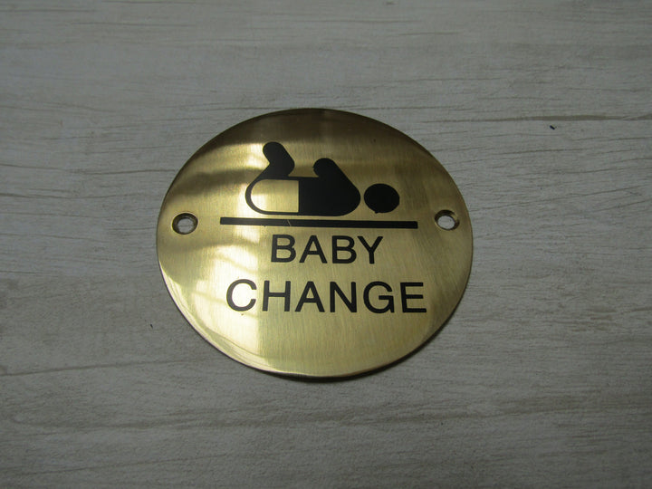 Circle Brass Baby Change Door Sign.