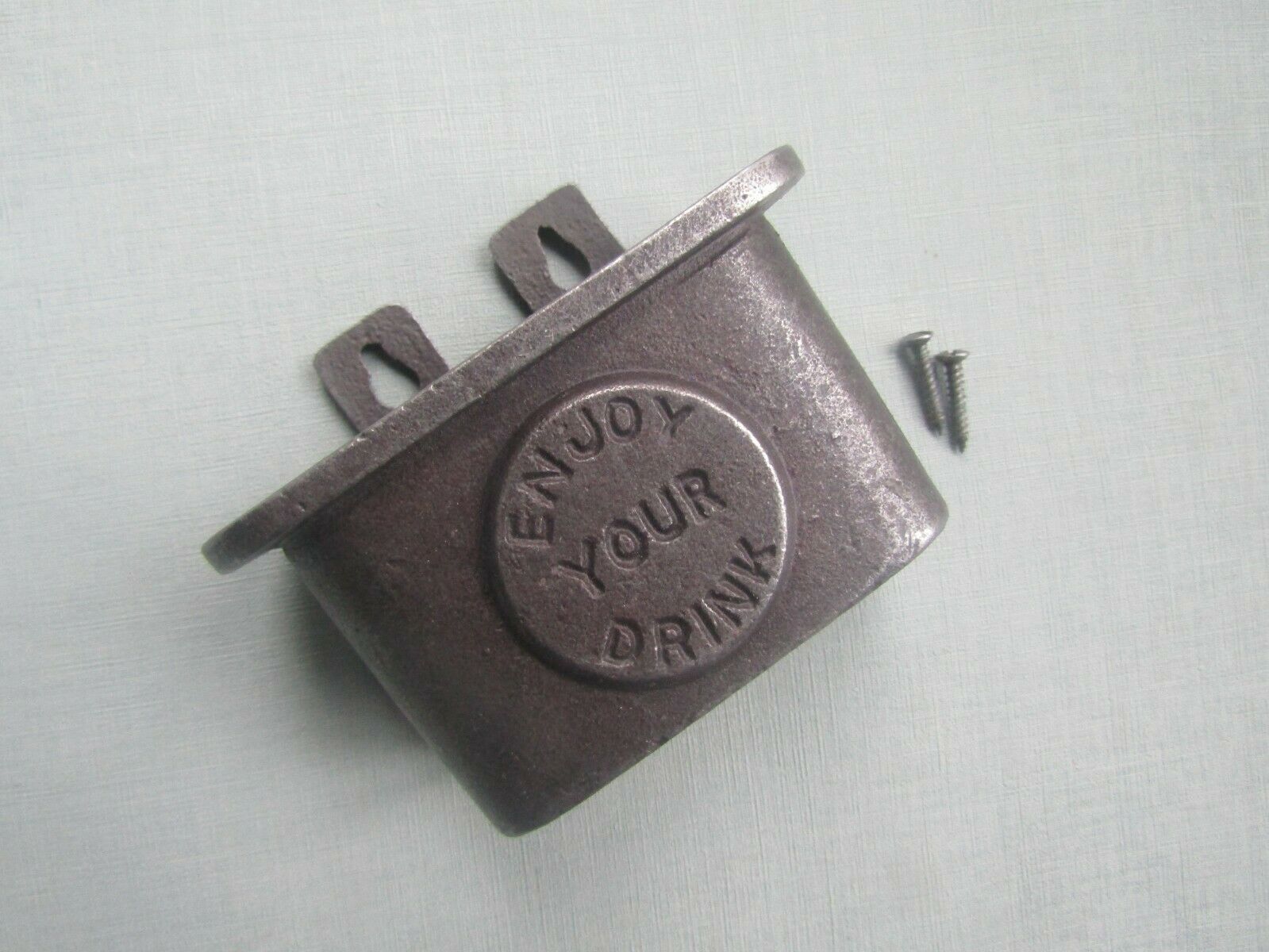 Cast Iron Enjoy Your Drink Cap Catcher.