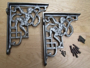 Pair Of Cherub Shelf Brackets Antique Iron.