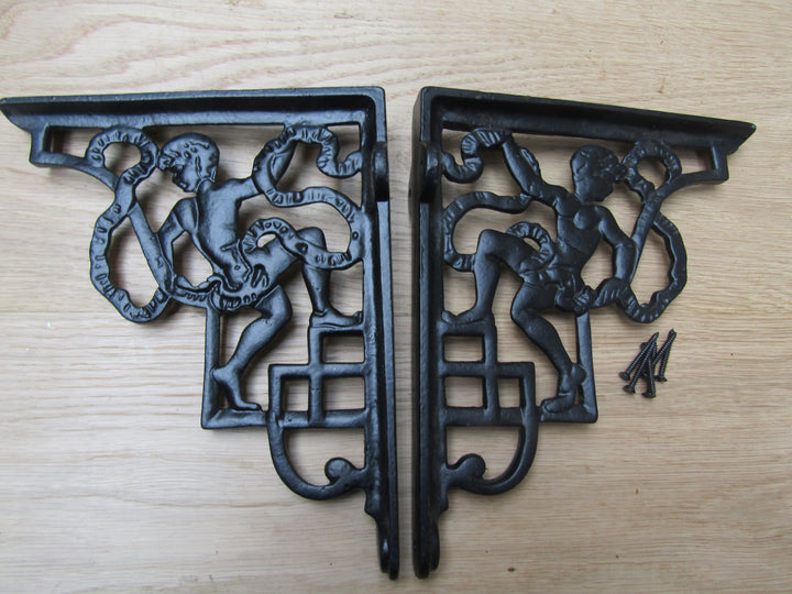 Pair Of Cherub Shelf Brackets Black Antique.