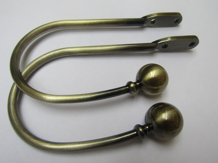 Pair of ball end Curtain hold backs Antique Brass.