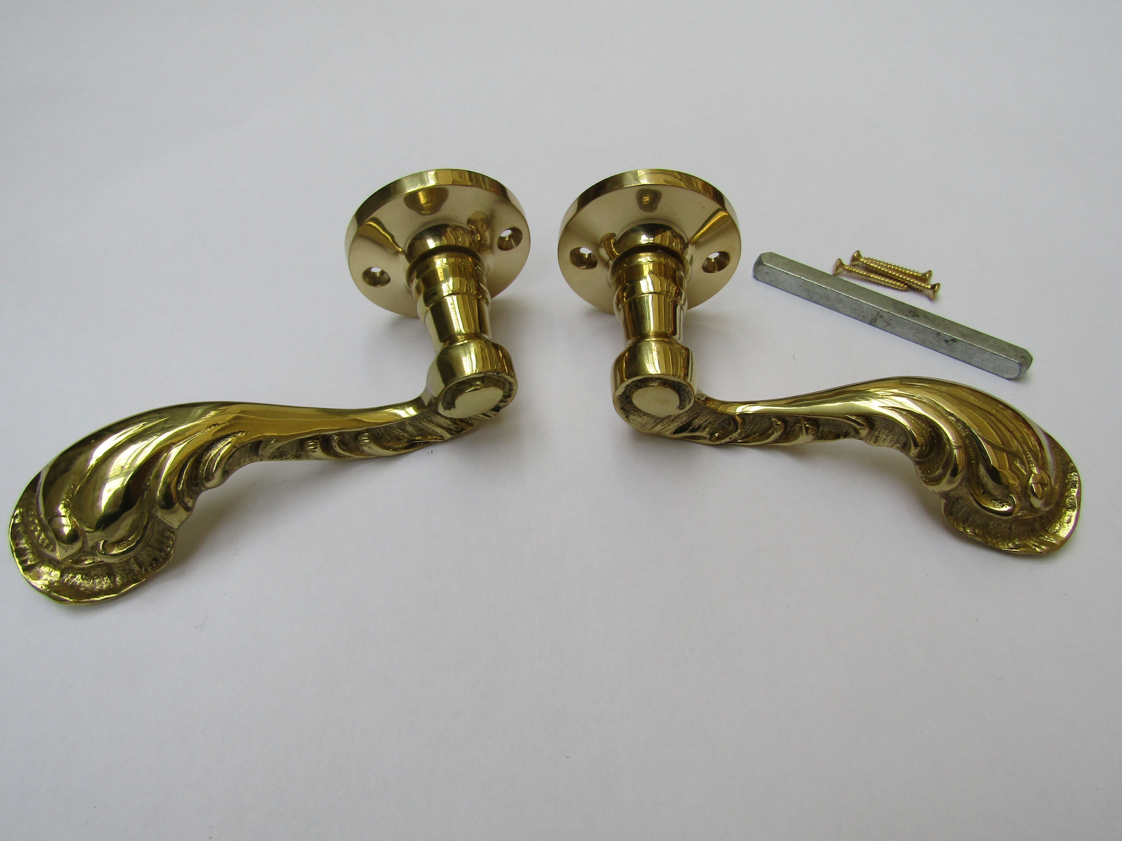 Pair Of Fancy Ornate Lever On Rose Door Handles Polished Brass.