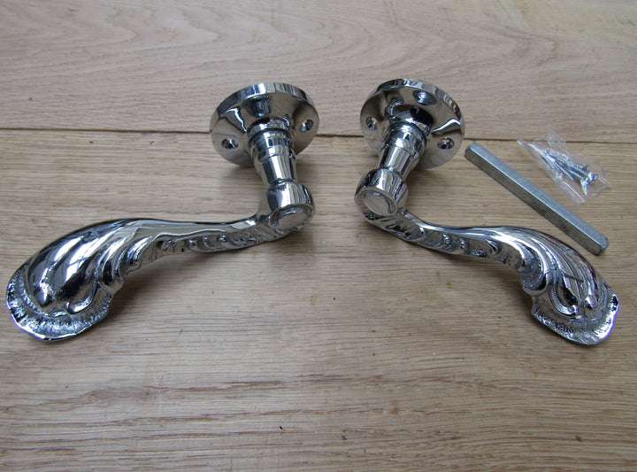 Pair Of Fancy Ornate Lever On Rose Door Handles Polished Chrome.