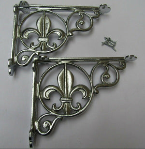 Pair Of Fleur De Lys Shelf Brackets Chrome.