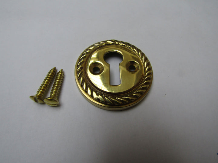 Georgian Open Escutcheon Polished Brass.
