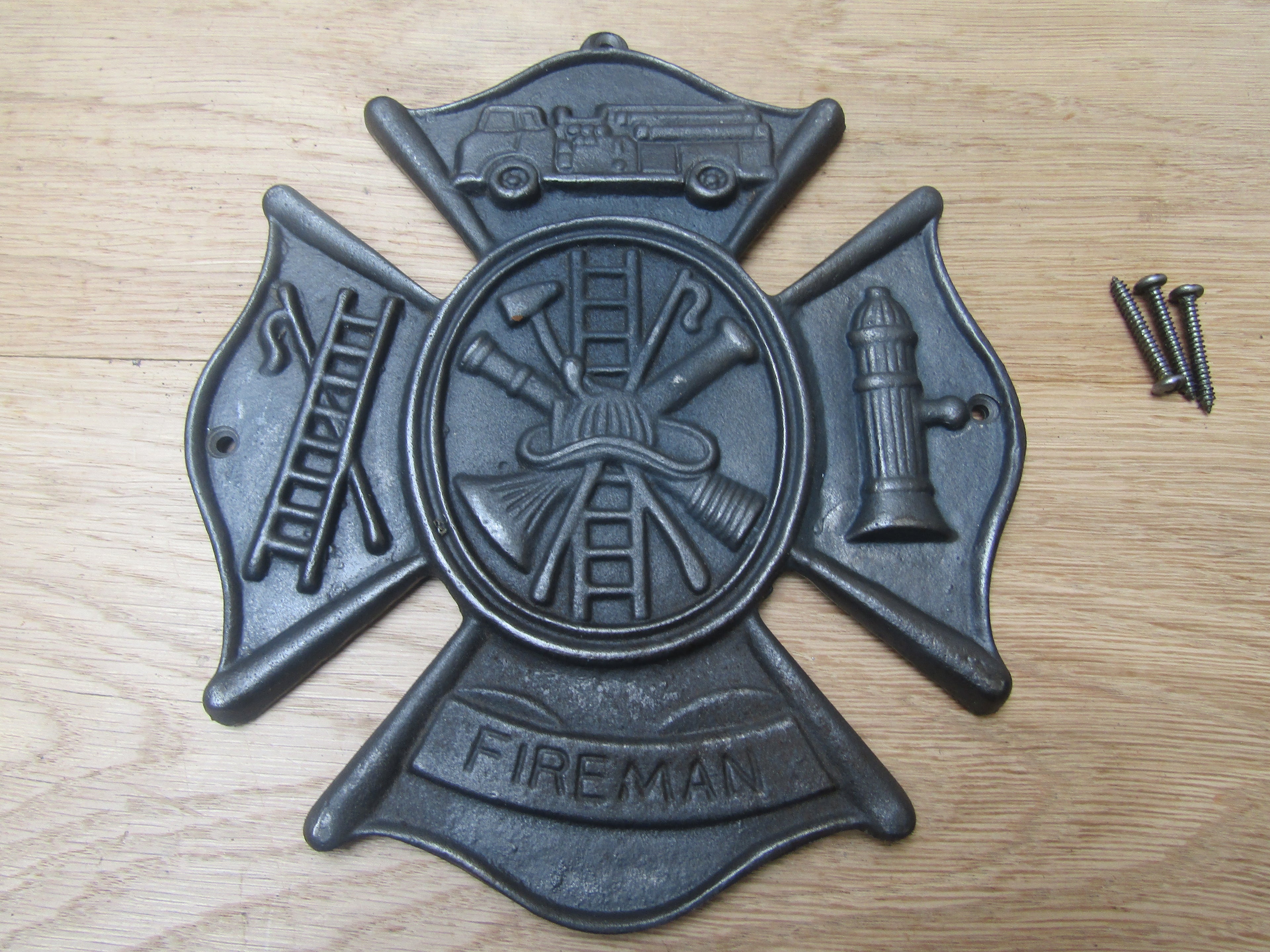 Cast Iron Fireman Emblem Plaque.