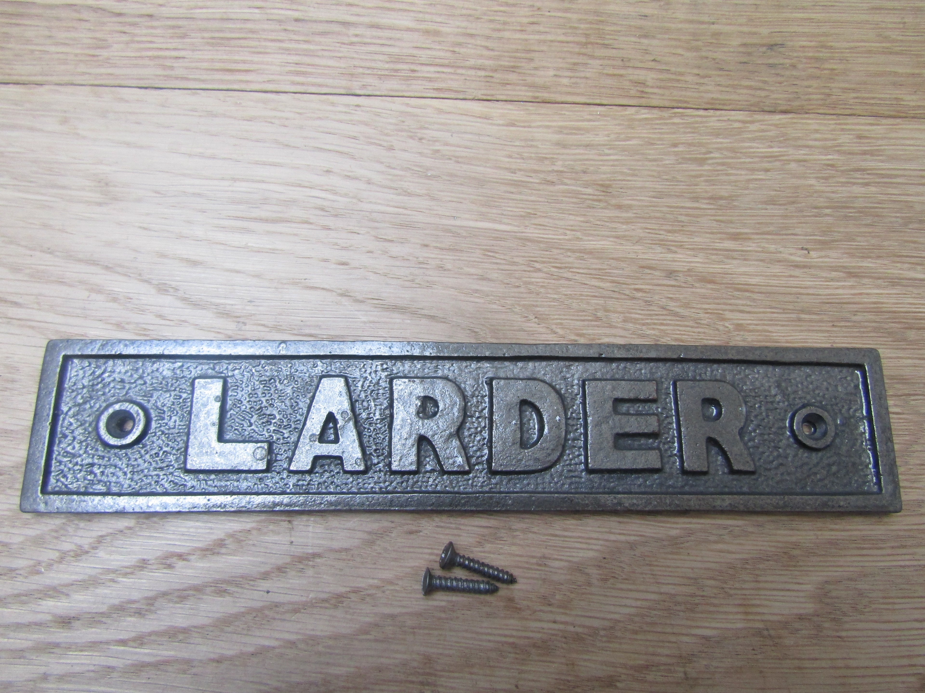 Cast Iron Larder Plaque.