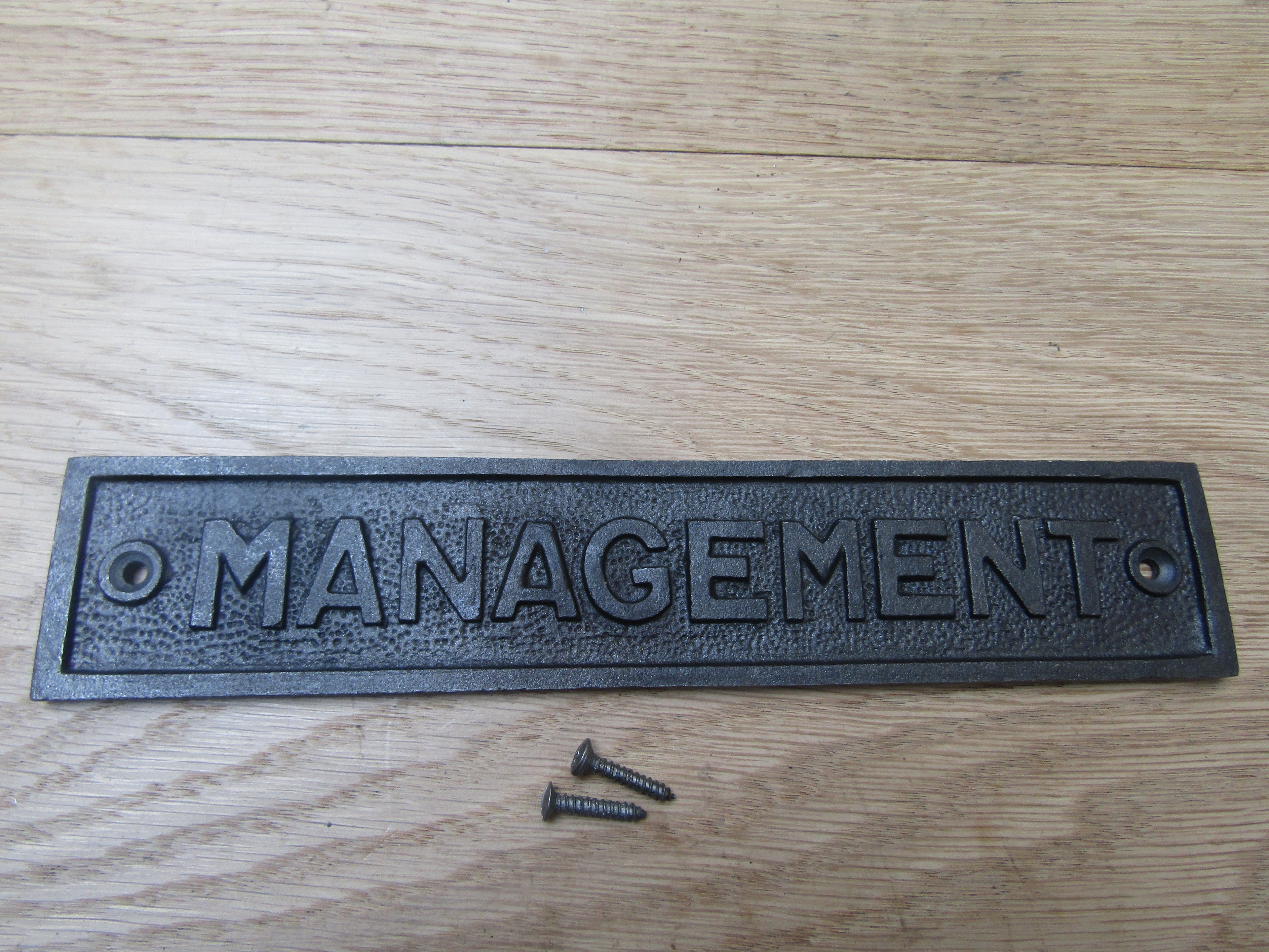 Cast Iron Management Plaque.