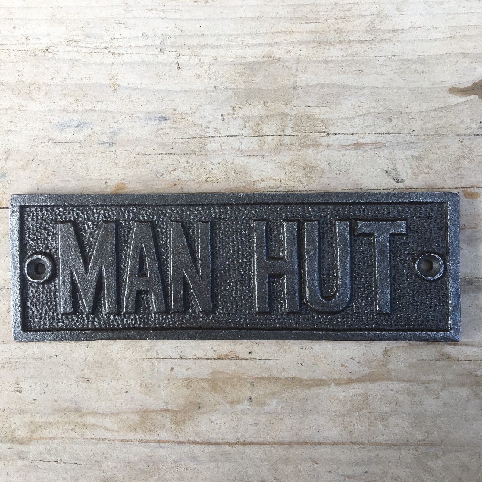 Cast Iron Manhut Plaque.