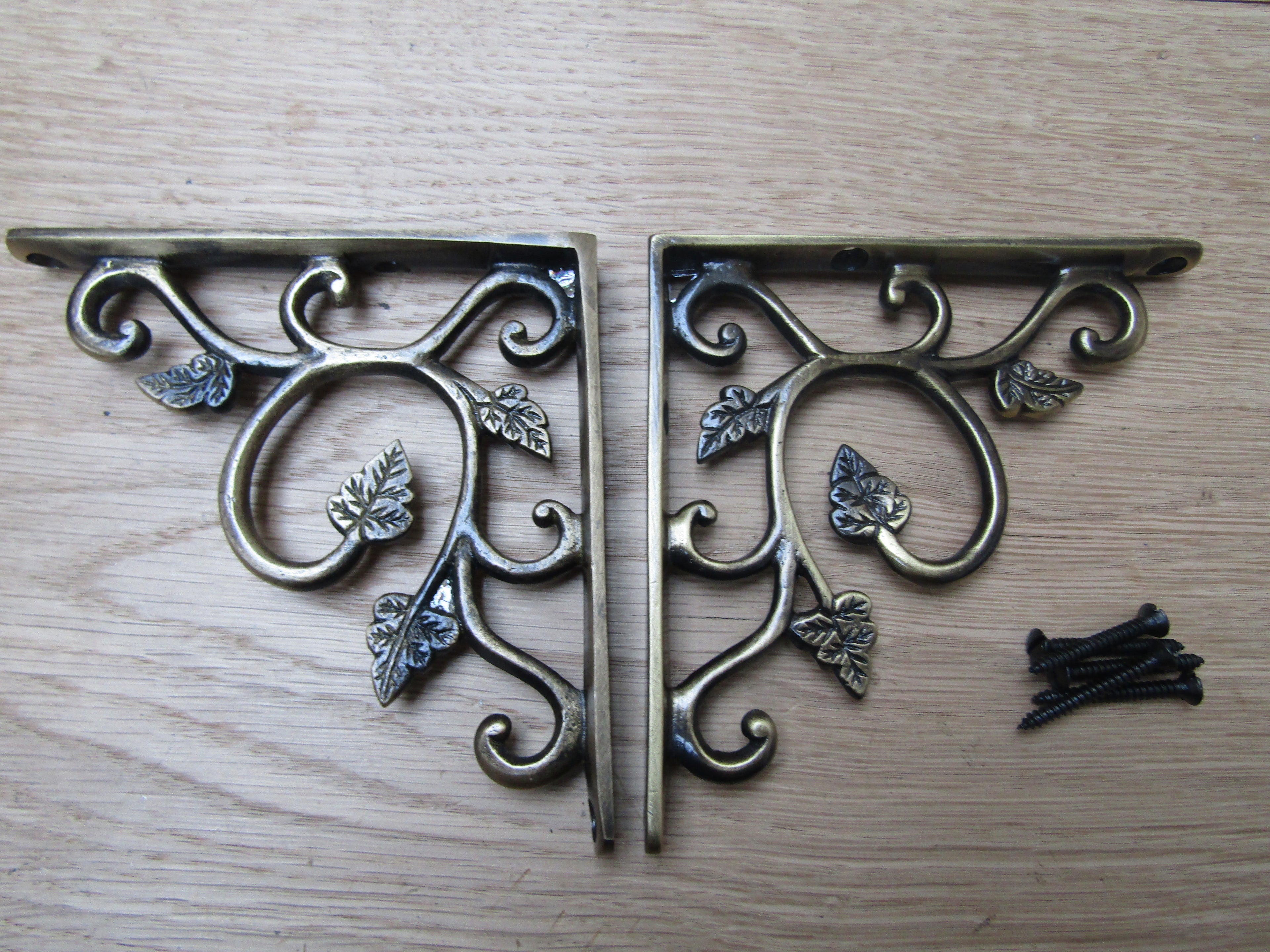 Pair Of Small Leaf Shelf Brackets Antique Brass.