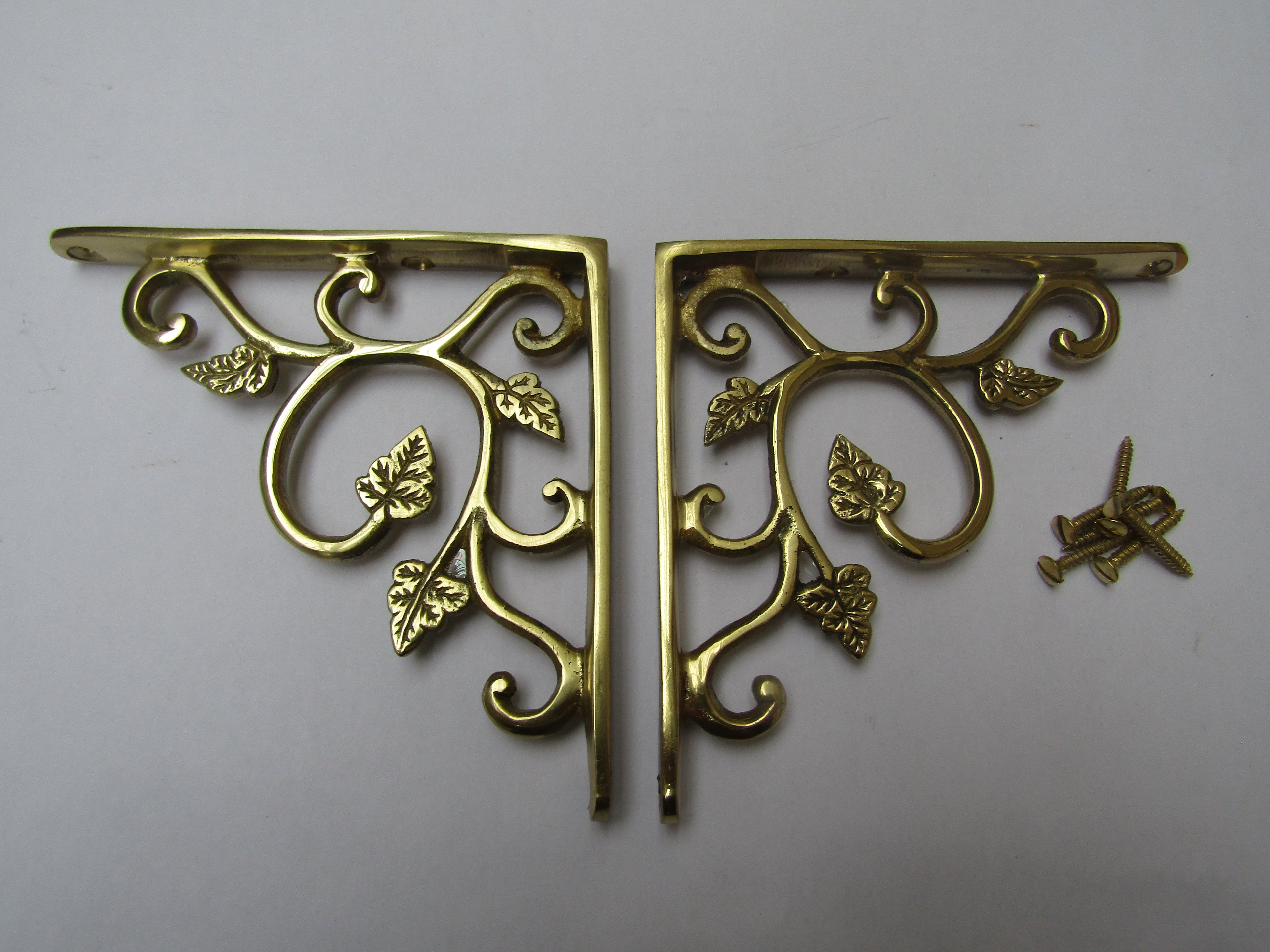 Pair Of Small Leaf Shelf Brackets Polished Brass.