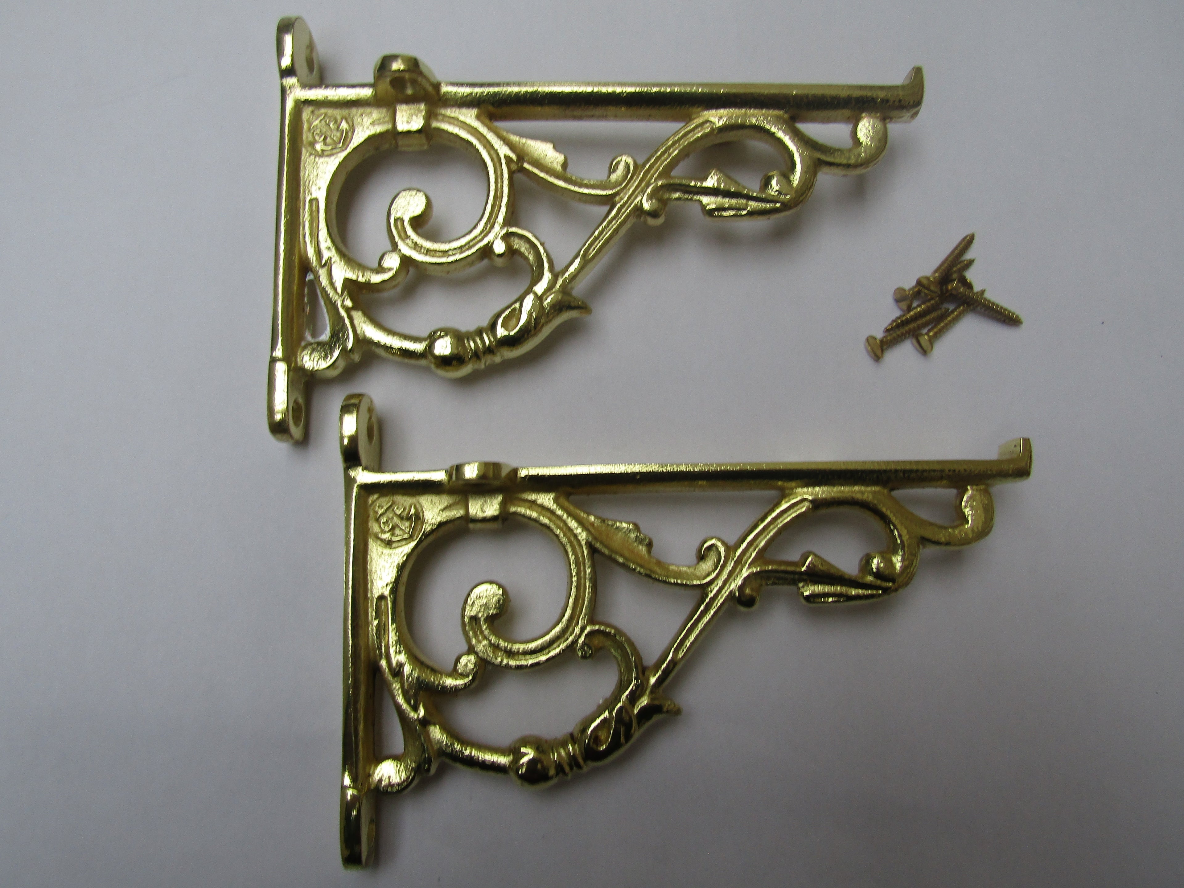Pair Of Small Lipped Shelf Brackets Polished Brass.