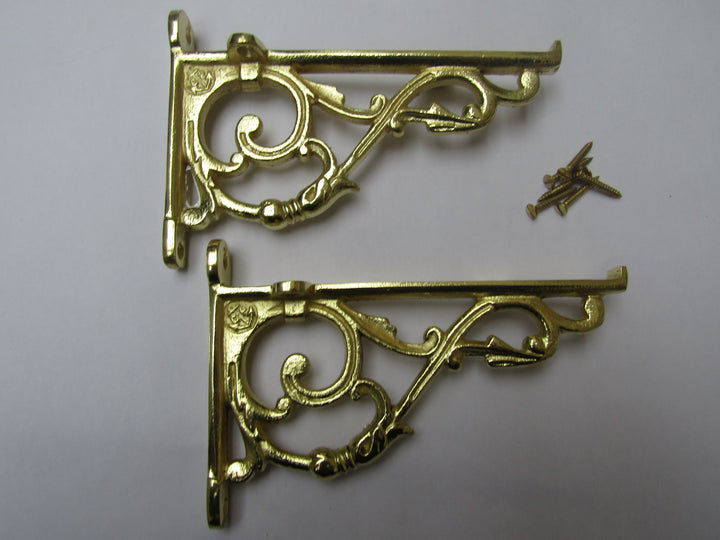 Pair Of Small Lipped Shelf Brackets Polished Brass.