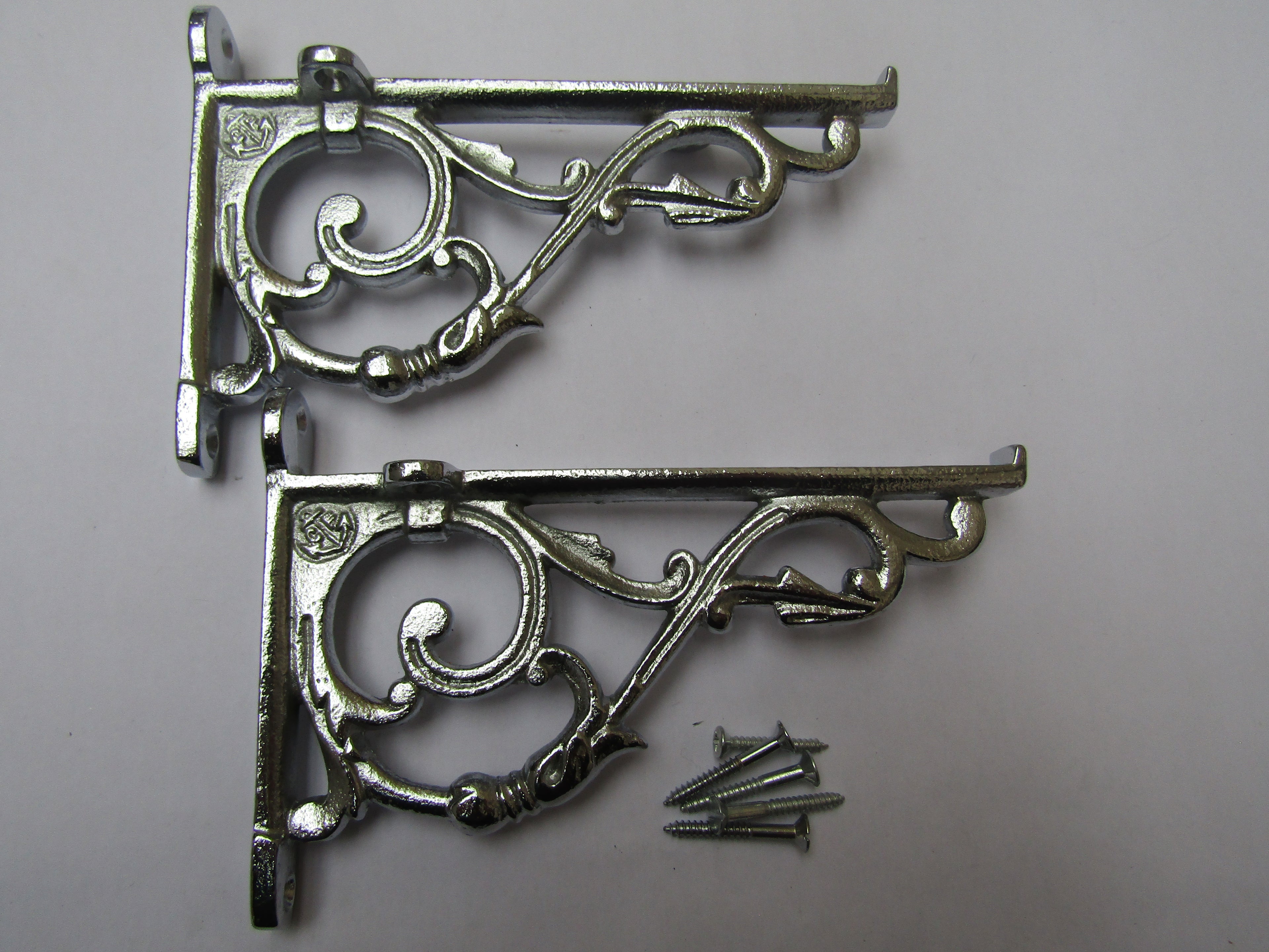 Pair Of Small Lipped Shelf Brackets Polished Chrome.