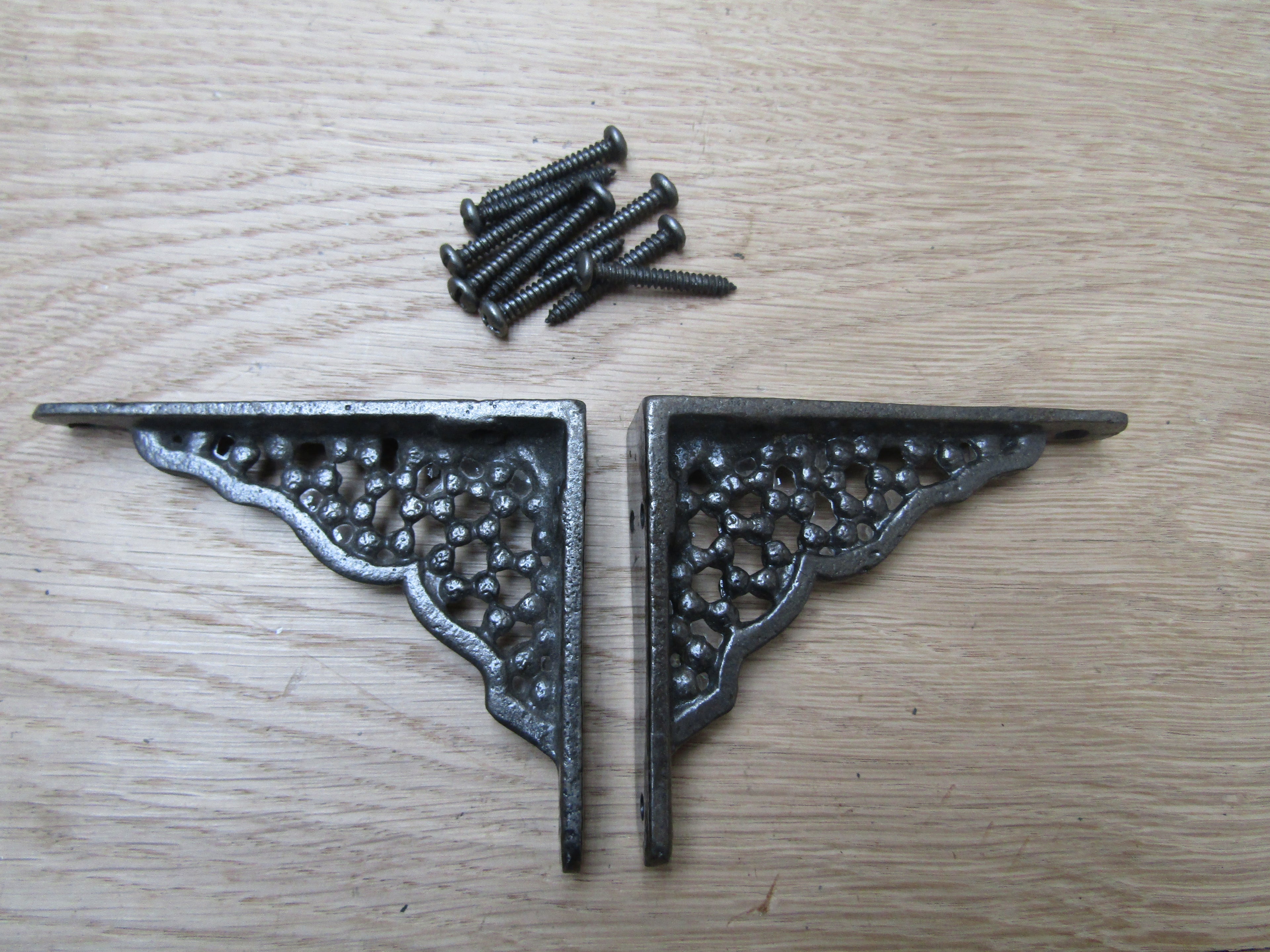 Pair Of Small Honeycomb Shelf Brackets Antique iron.