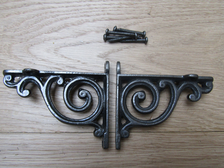 Pair Of Swirl Shelf Brackets Antique iron.