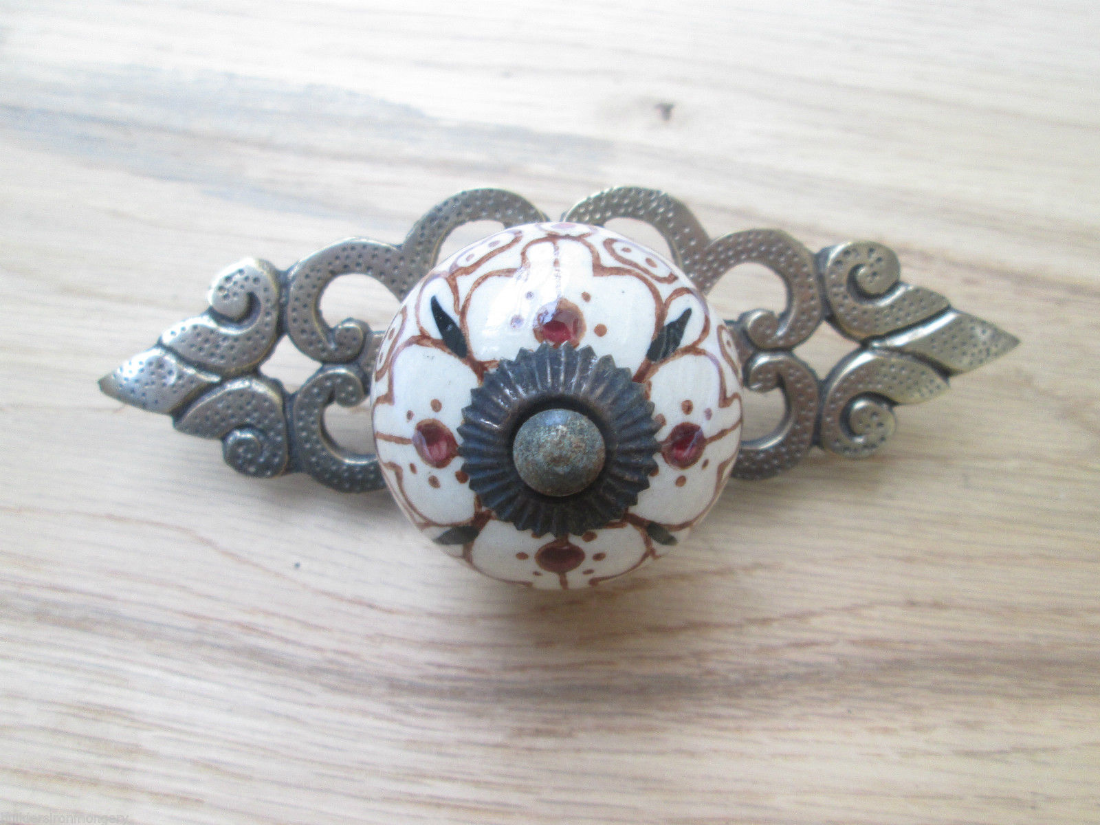 Patterned Cabinet Knob with Antique Brass Back Plate.