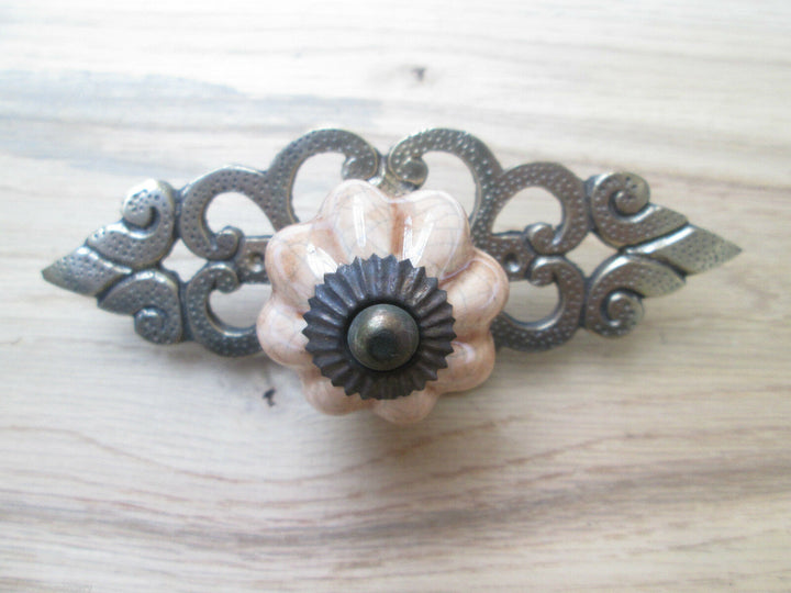 Pink Ceramic Cabinet Knob with Antique Brass Back Plate.