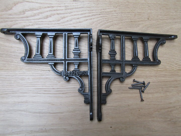 Pair Of Roman Column Shelf Brackets Antique iron.