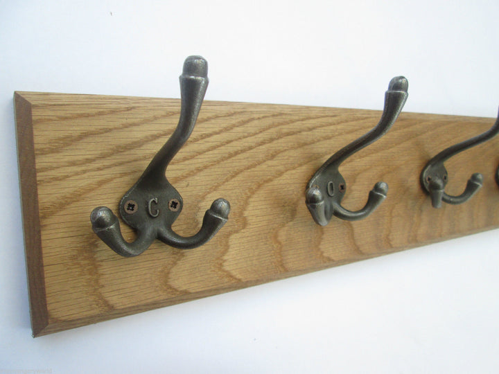 Cast iron Triple Lettered Coat Hook Rail.