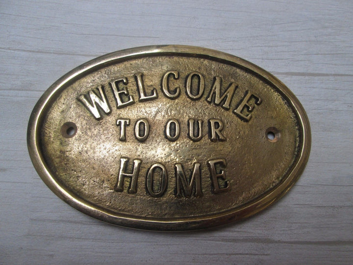 Welcome To Our Home Plaque Brass.