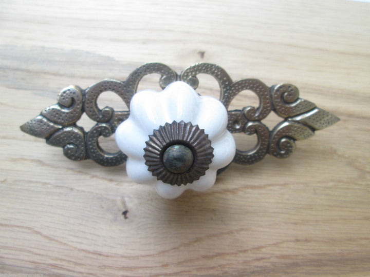 White Ceramic Cabinet Knob with Antique Brass Back Plate.